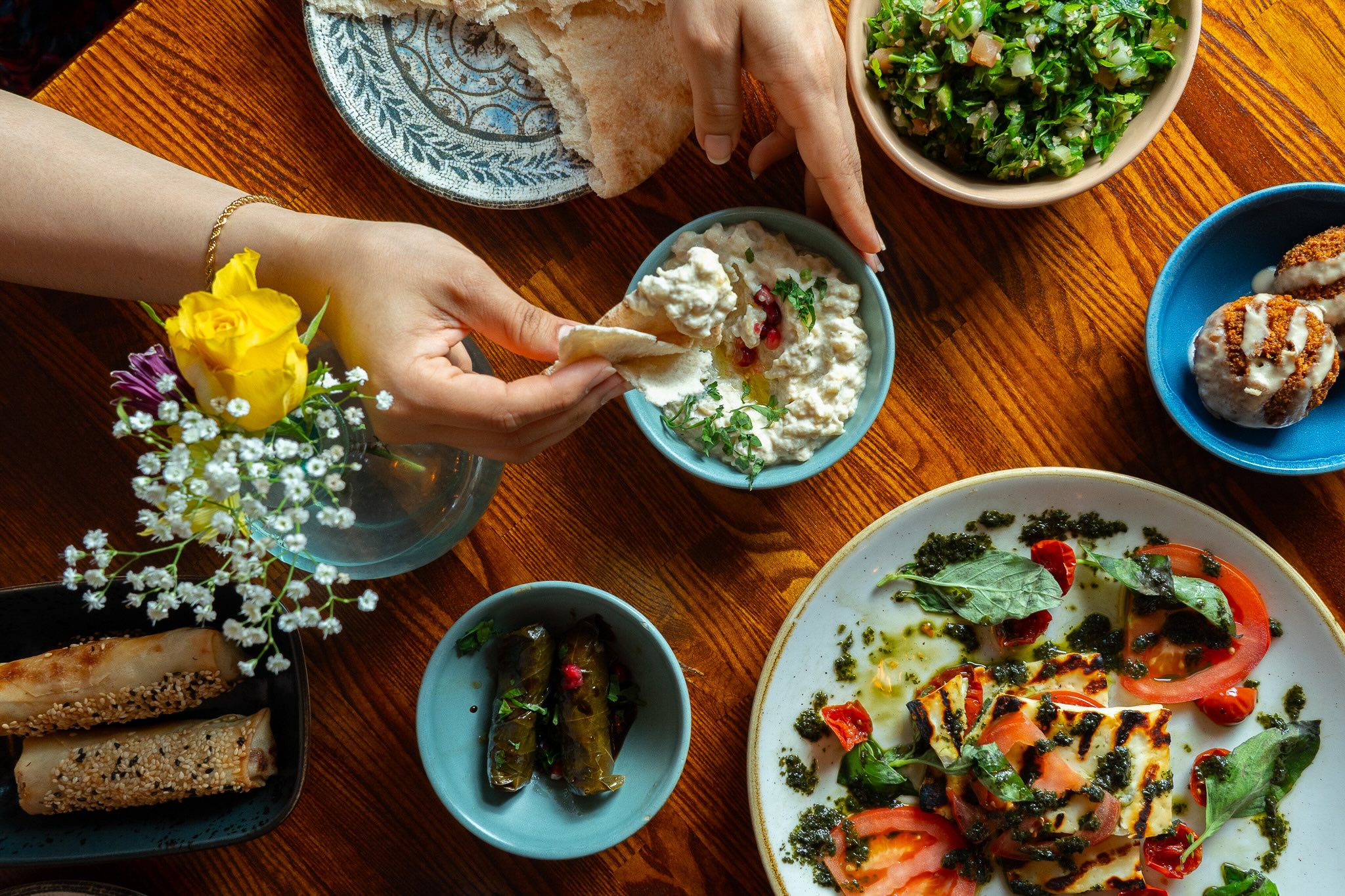Mezze spread photographed overhead on a wooden table in a Dublin restaurant